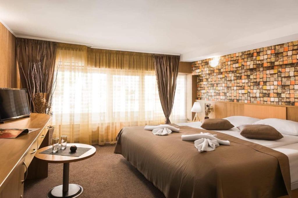 Postel nebo postele na pokoji v ubytování Hotel Central Point