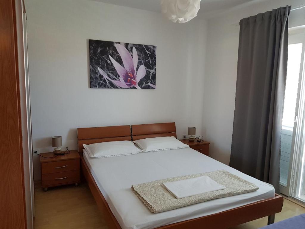Postel nebo postele na pokoji v ubytování Apartments Andelic