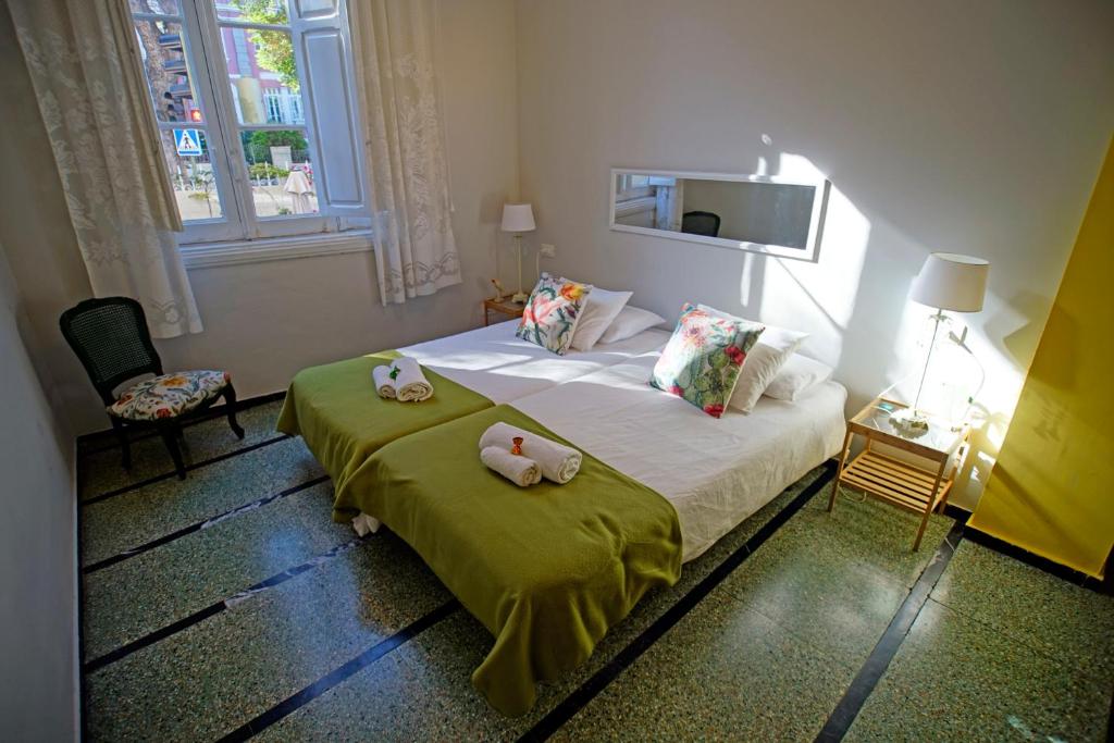 Postel nebo postele na pokoji v ubytování Casa Kilig
