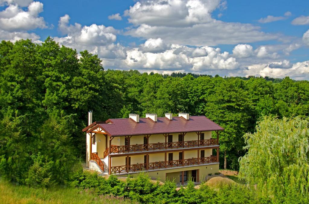 a house in the middle of a forest at Ośrodek Dąbrówka in Suwałki