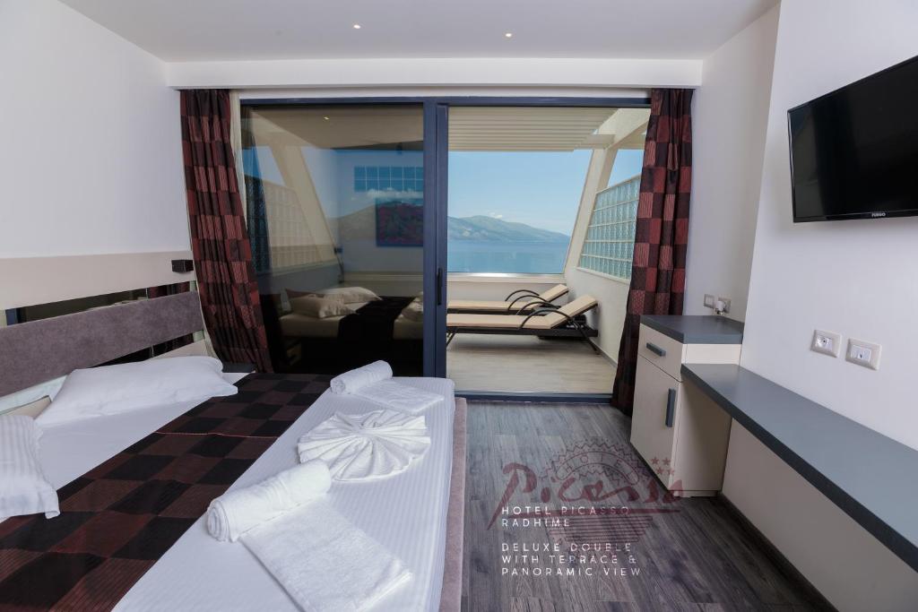 Postel nebo postele na pokoji v ubytování Hotel Picasso
