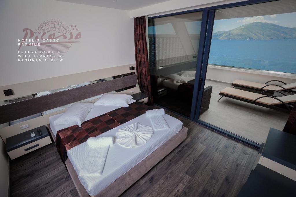 Postel nebo postele na pokoji v ubytování Hotel Picasso