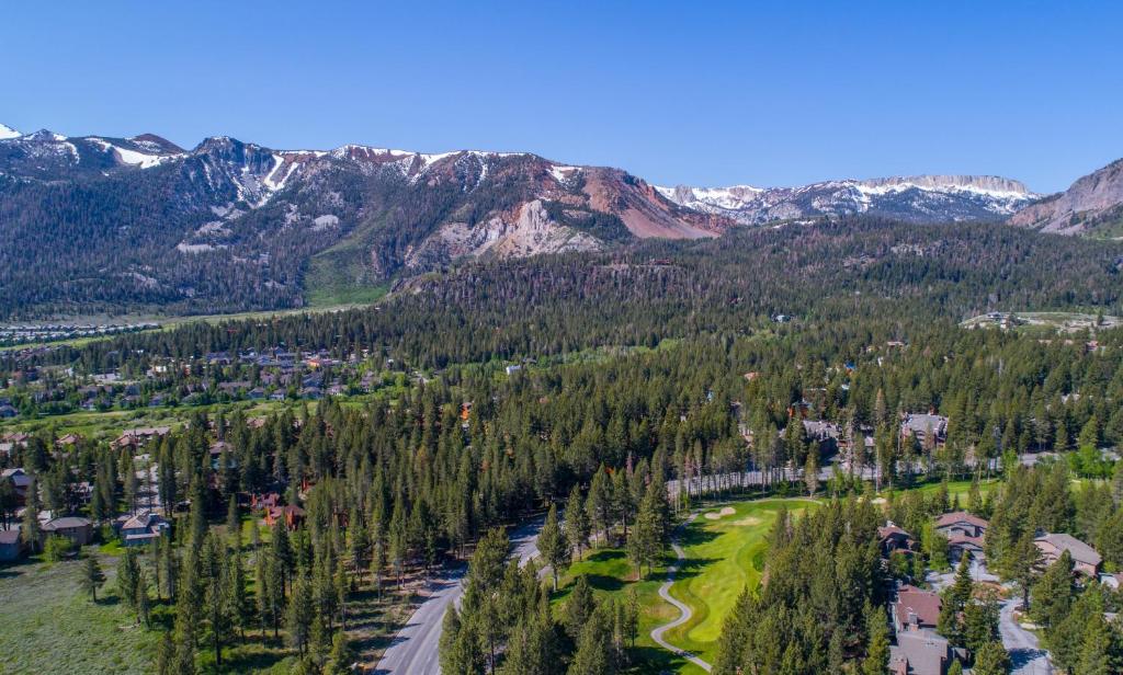 an aerial view of a resort in the mountains at Mammoth Golf Properties By 101 Great Escapes in Mammoth Lakes