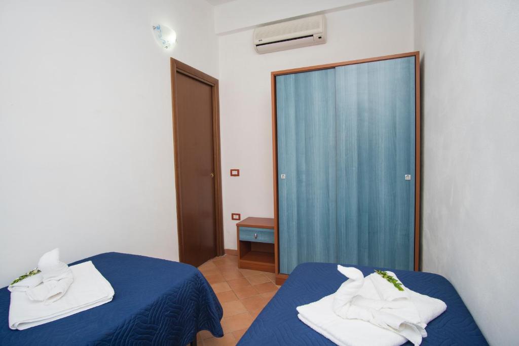 Postel nebo postele na pokoji v ubytování Cilento Dreams Village