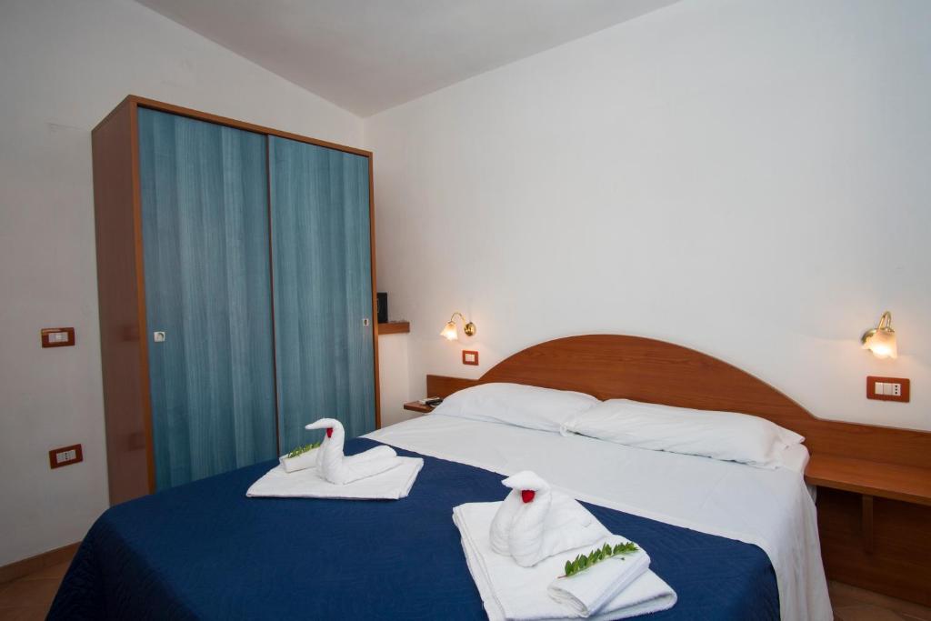 Postel nebo postele na pokoji v ubytování Cilento Dreams Village