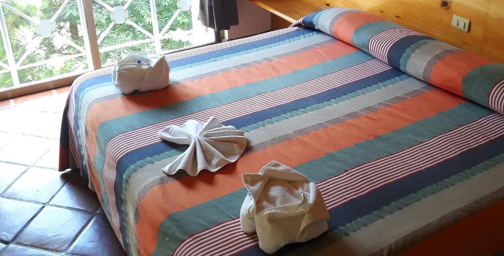 Postel nebo postele na pokoji v ubytování Axkan Arte Hotel