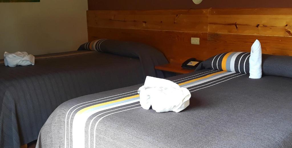 Postel nebo postele na pokoji v ubytování Axkan Arte Hotel