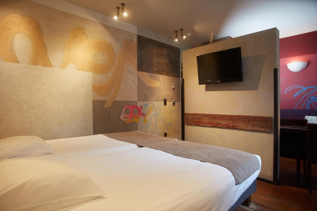Postel nebo postele na pokoji v ubytování Boutique Hotel Saint-Géry