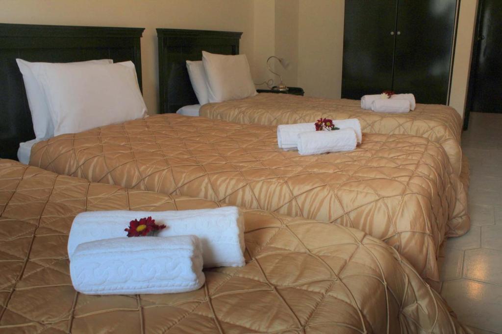 Posteľ alebo postele v izbe v ubytovaní Famissi Eden Hotel