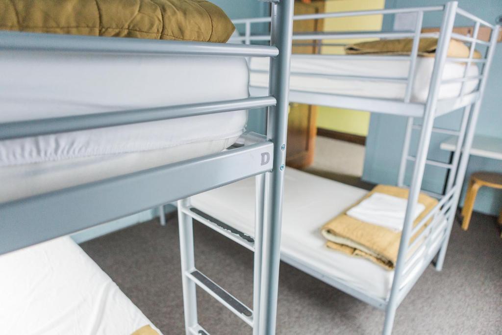 Postel nebo postele na pokoji v ubytování American Hotel Hostel