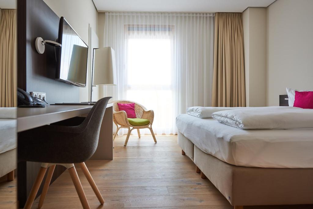 Postel nebo postele na pokoji v ubytování Hotel Calamus - 4 Sterne Superior