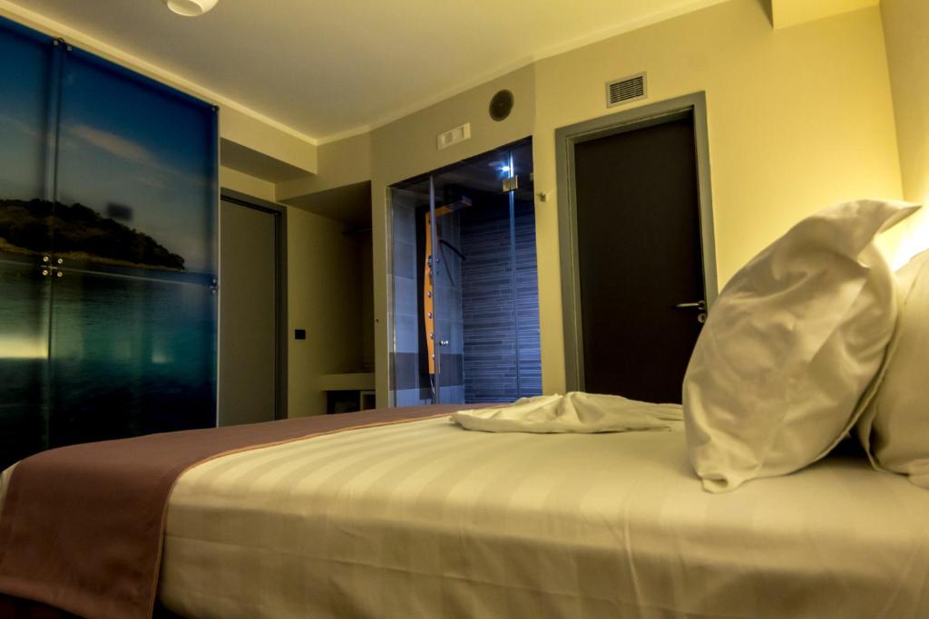 Postel nebo postele na pokoji v ubytování Hotel Pandora Residence