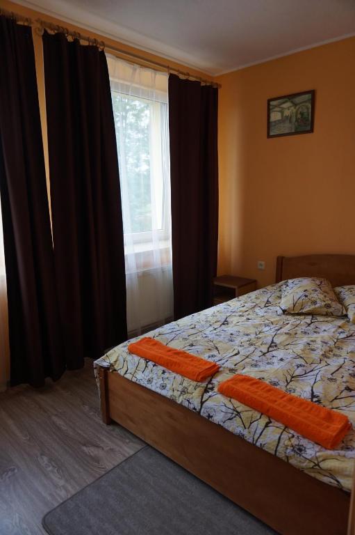 Postel nebo postele na pokoji v ubytování Guesthouse Bērzi