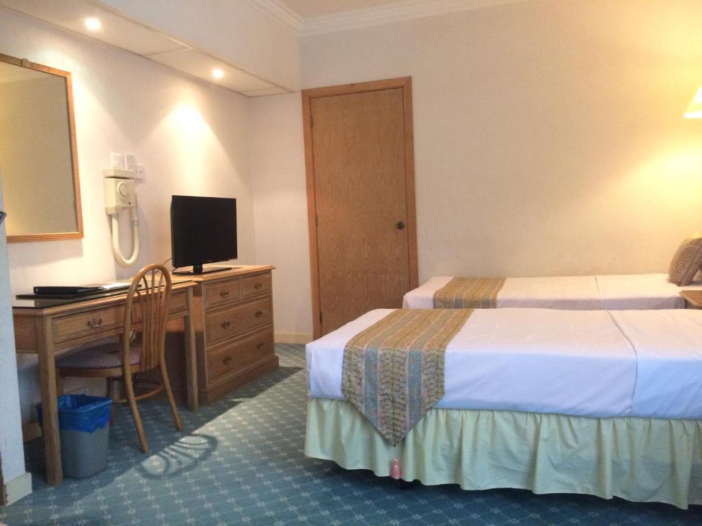 Postel nebo postele na pokoji v ubytování Terrace Hotel