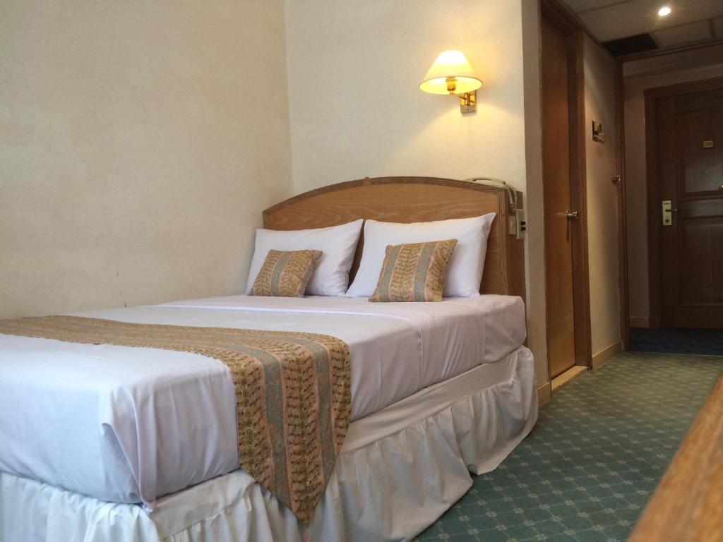 Postel nebo postele na pokoji v ubytování Terrace Hotel