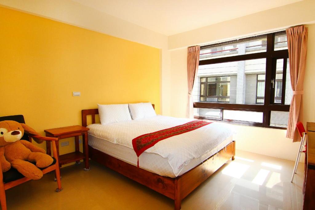 Postel nebo postele na pokoji v ubytování Yilan B&B - Happy Snail