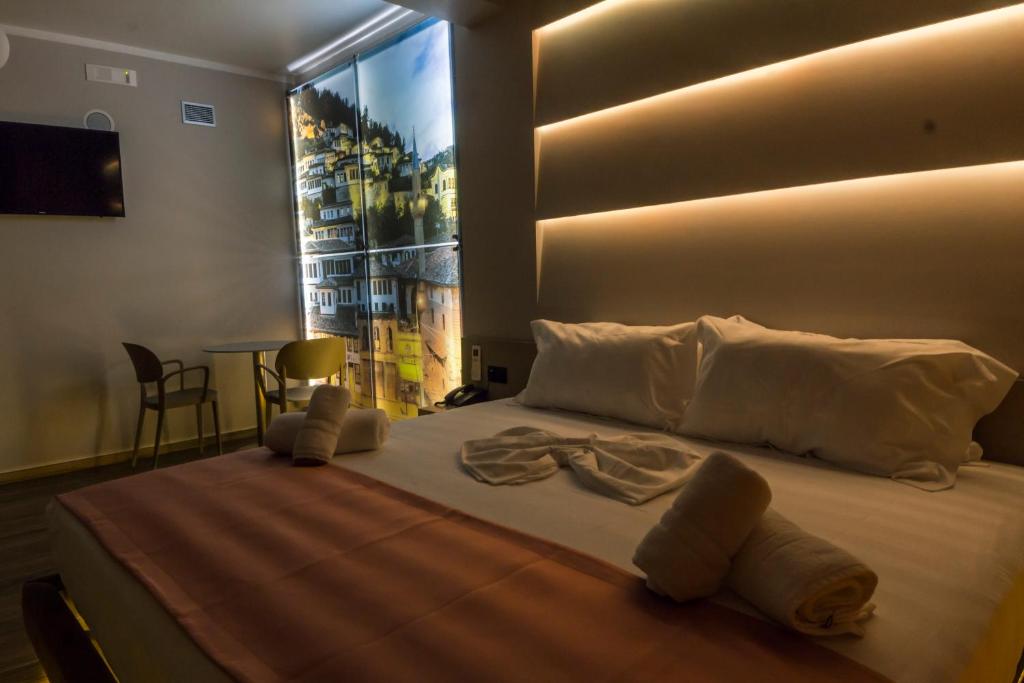 Postel nebo postele na pokoji v ubytování Hotel Pandora Residence