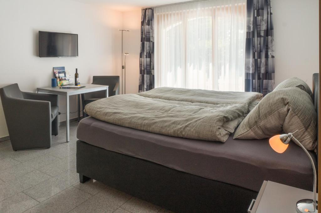 Postel nebo postele na pokoji v ubytování A Calm & Charm Studio - Haus Haro