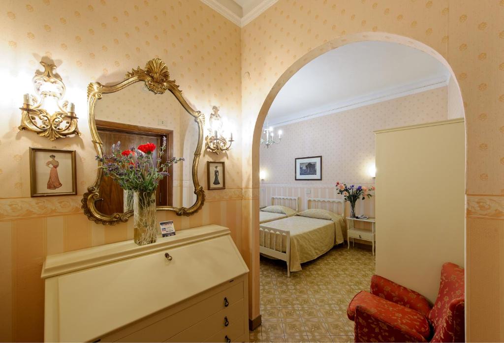 Postel nebo postele na pokoji v ubytování Albergo Il Marzocco - Hotel dal 1860