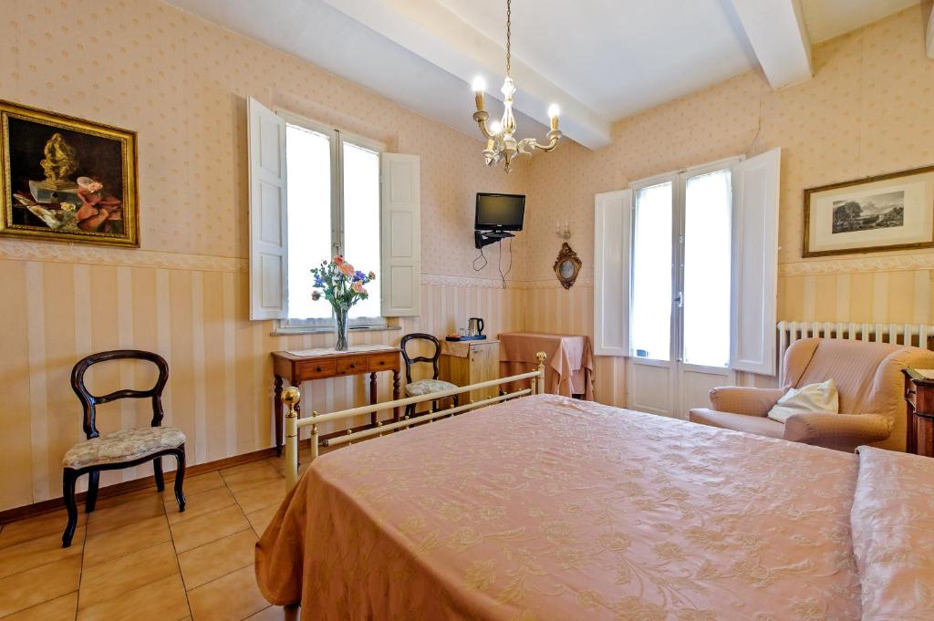 Postel nebo postele na pokoji v ubytování Albergo Il Marzocco - Hotel dal 1860