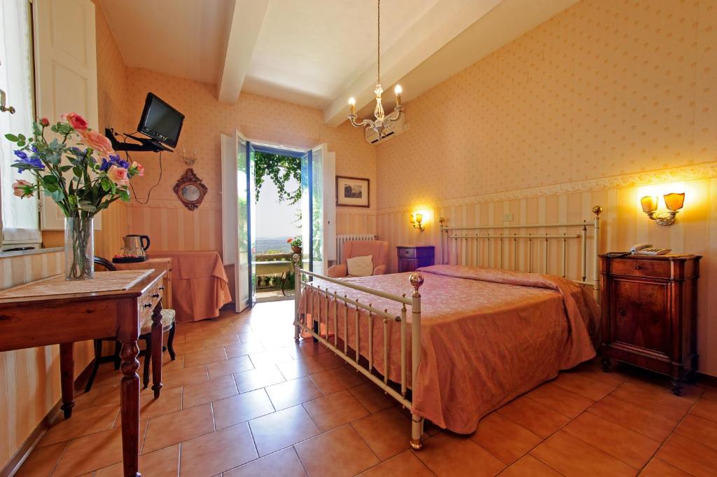 Postel nebo postele na pokoji v ubytování Albergo Il Marzocco - Hotel dal 1860