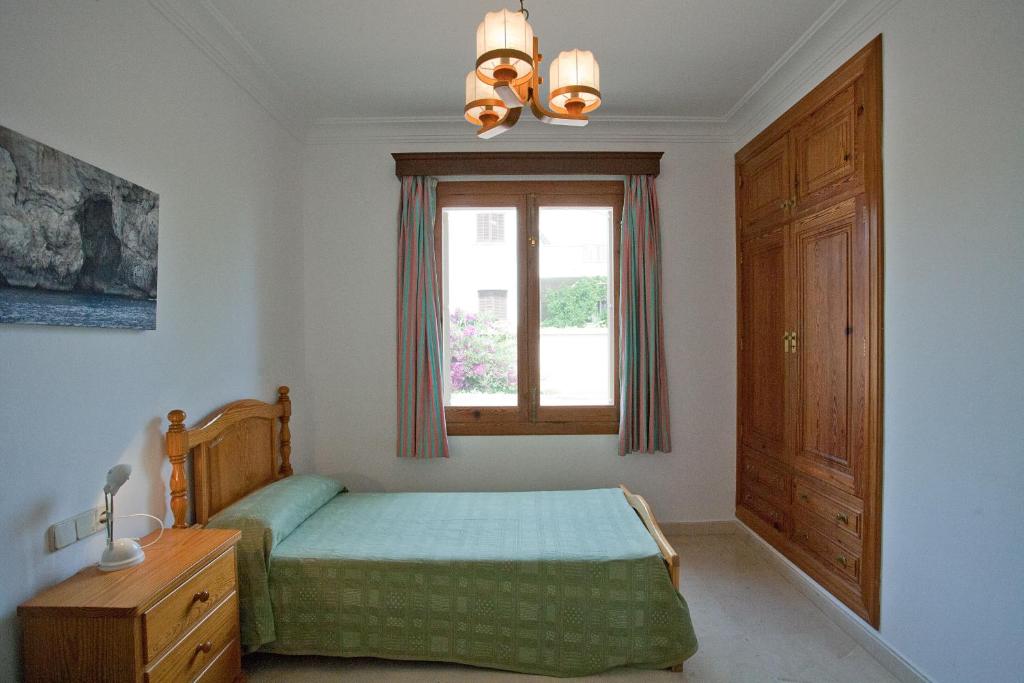 Postel nebo postele na pokoji v ubytování Villa Sa Coma