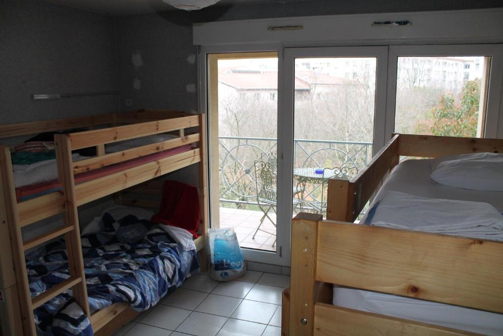 Krevet ili kreveti u jedinici u okviru objekta La Petite Auberge de Saint-Sernin