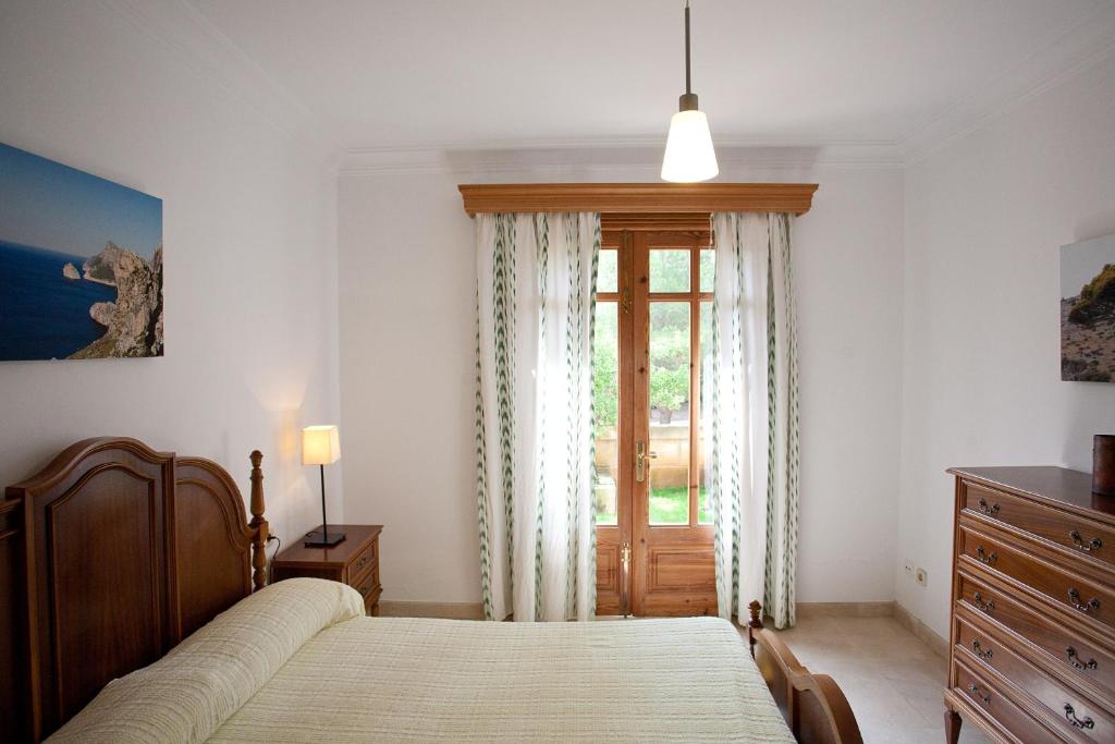Postel nebo postele na pokoji v ubytování Villa Sa Coma