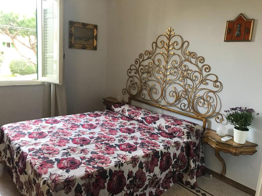 A bed or beds in a room at Albergo Battelli