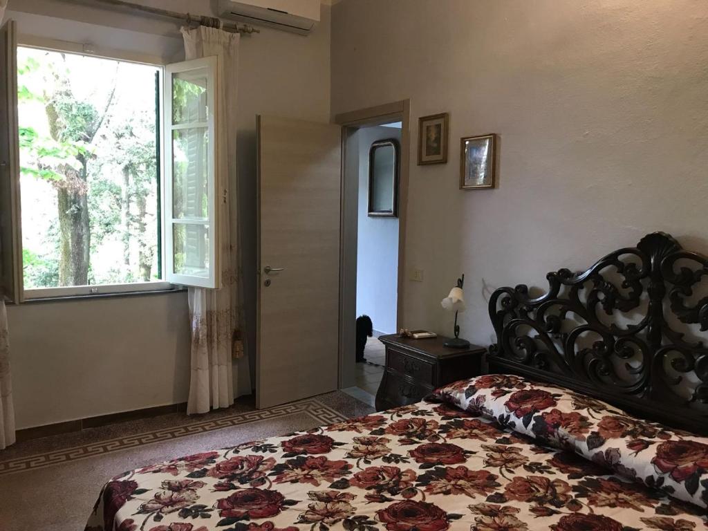A bed or beds in a room at Albergo Battelli
