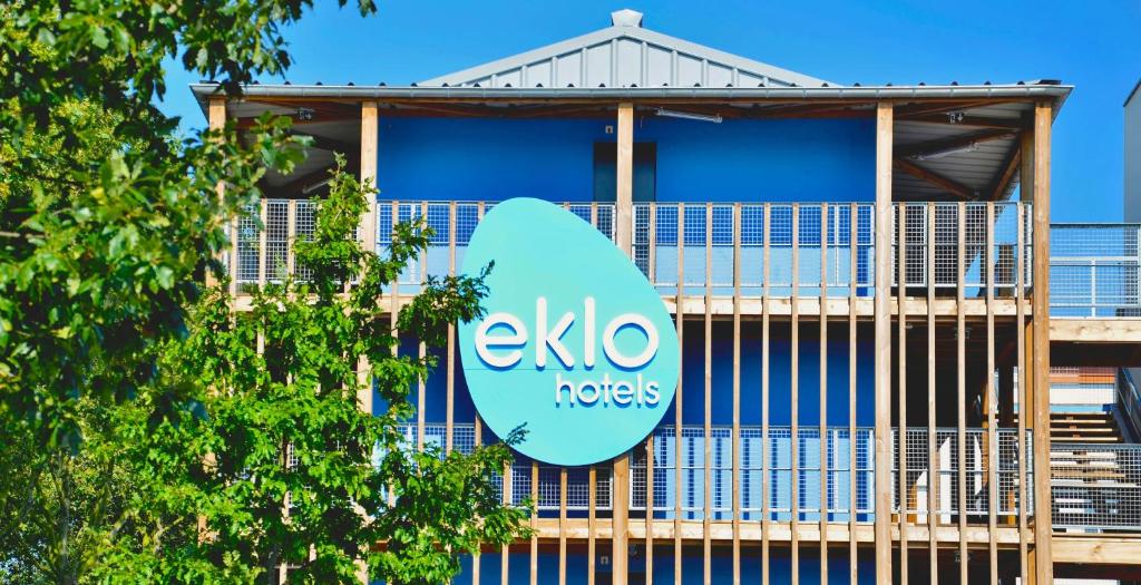 a blue and white building with a blue sky at Eklo Hotels Le Havre in Le Havre