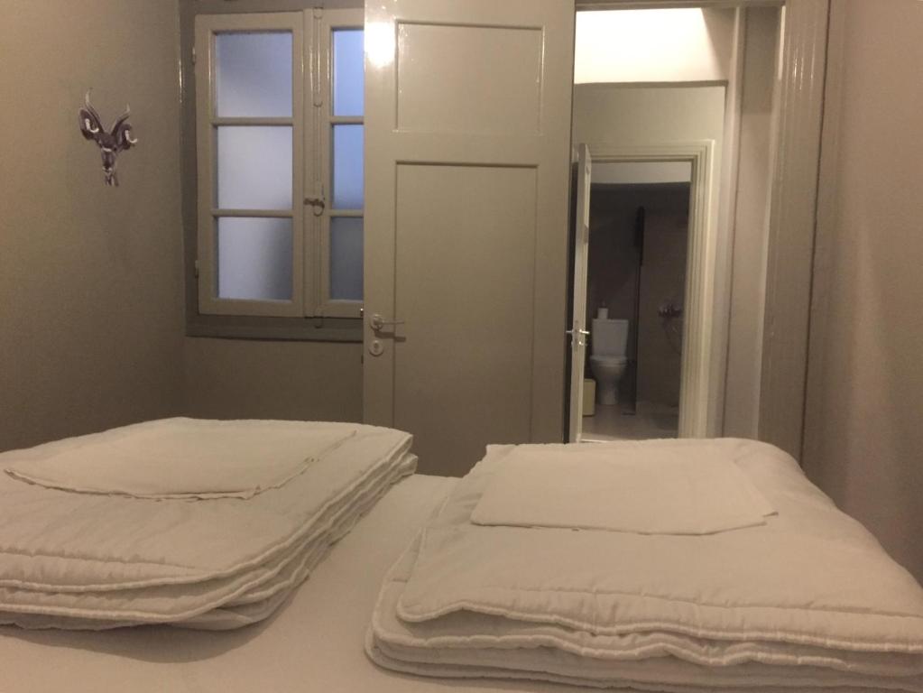 Posteľ alebo postele v izbe v ubytovaní Nubian Hostel