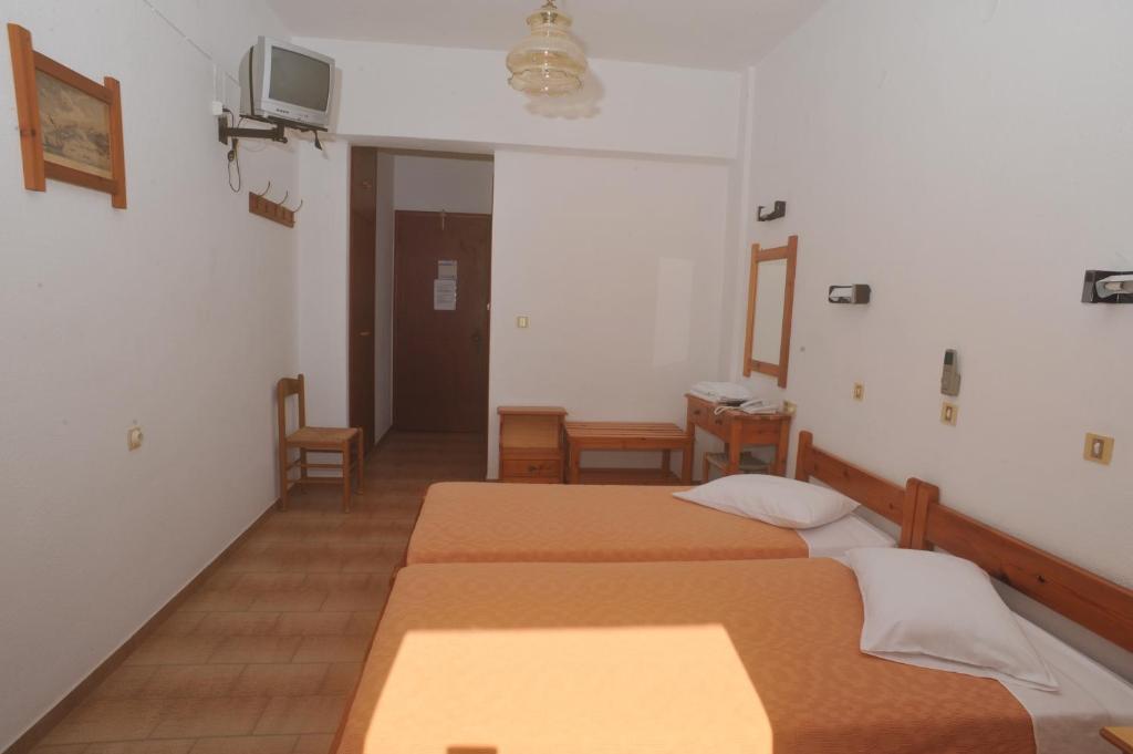 Postel nebo postele na pokoji v ubytování Casteli Hotel