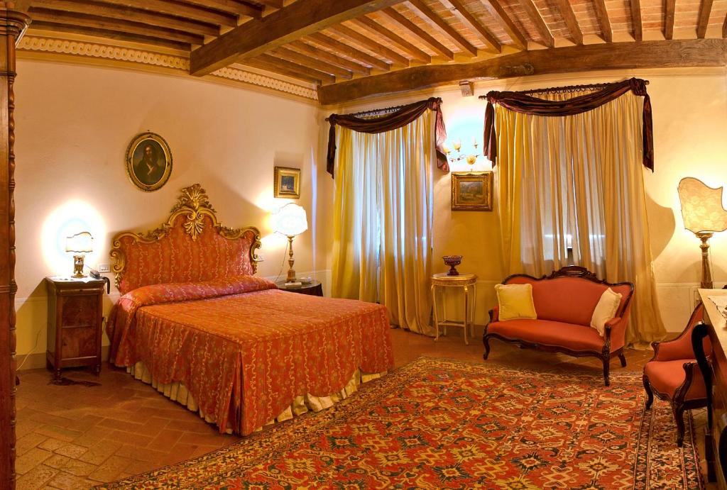 Postel nebo postele na pokoji v ubytování Relais Villa Baldelli