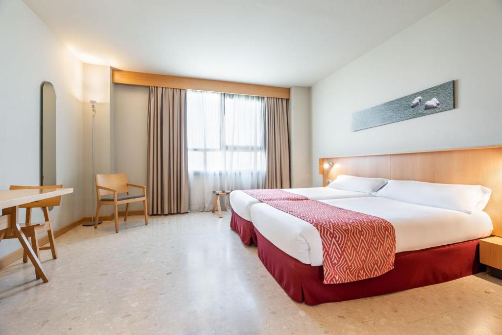 Postel nebo postele na pokoji v ubytování Aparthotel Exe Campus San Mamés