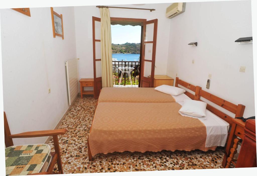 Postel nebo postele na pokoji v ubytování Casteli Hotel