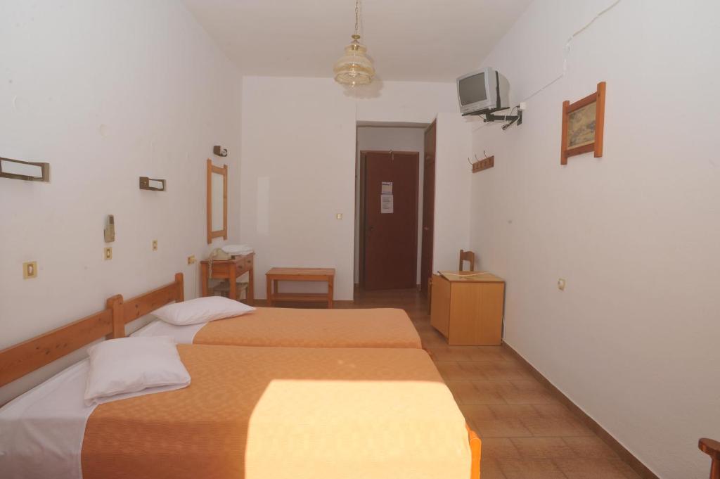 Postel nebo postele na pokoji v ubytování Casteli Hotel