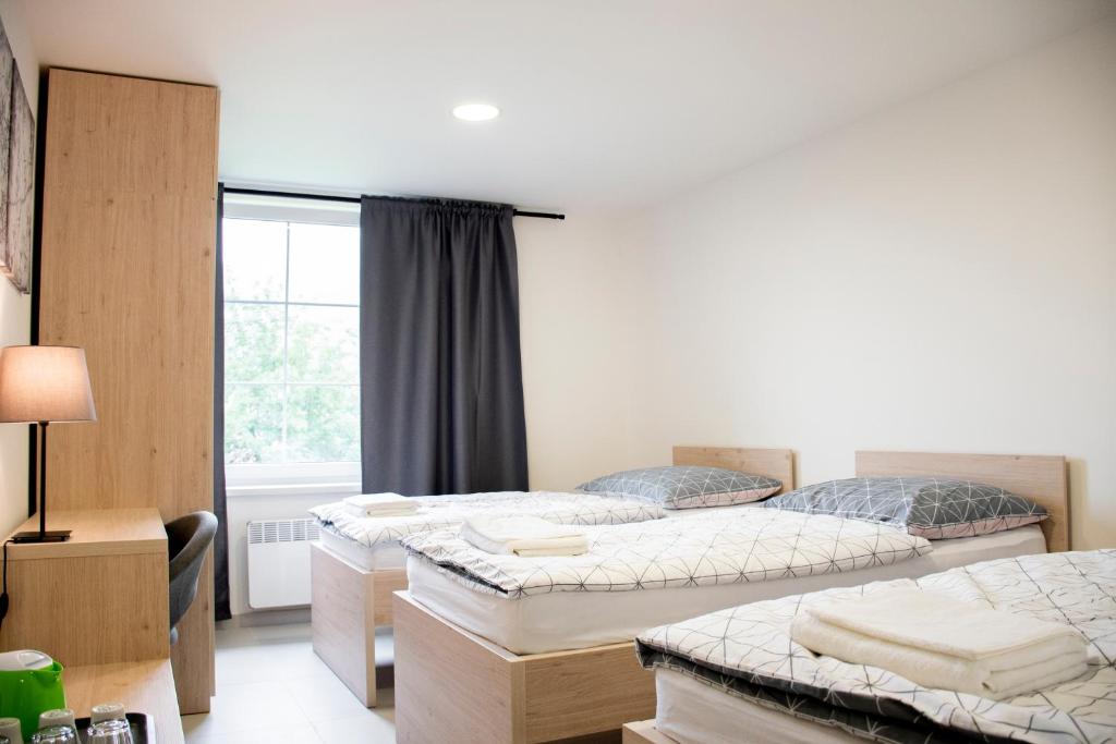 Postel nebo postele na pokoji v ubytování Penzion Šafrán