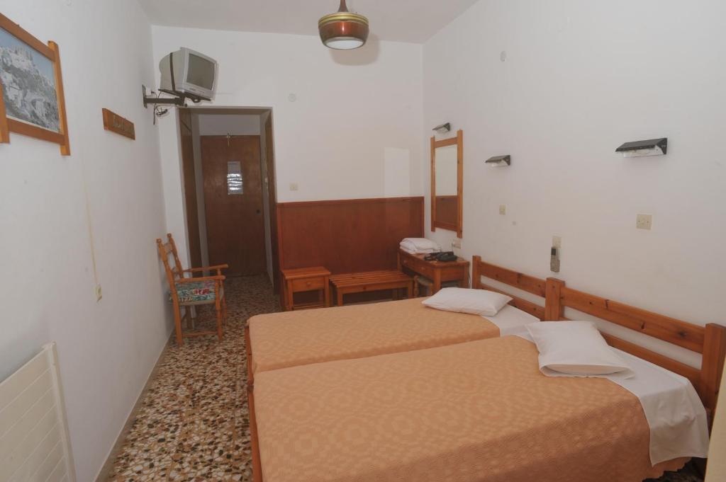 Postel nebo postele na pokoji v ubytování Casteli Hotel