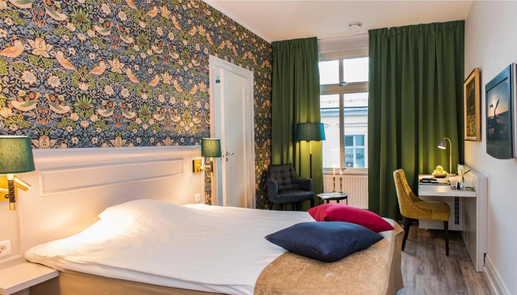 Postel nebo postele na pokoji v ubytování SPiS Hotell Amber