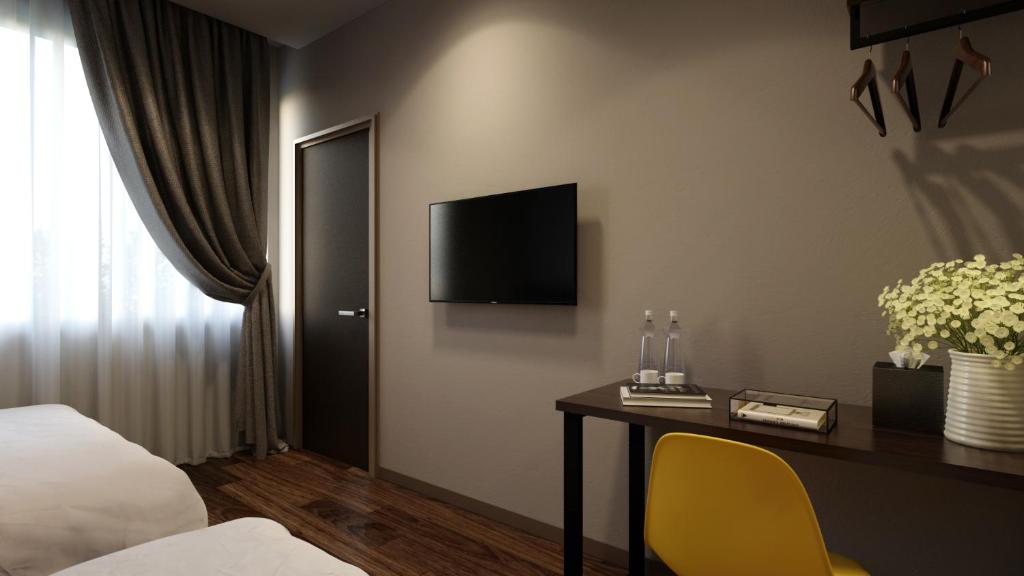 TV a/nebo společenská místnost v ubytování The Square Hotel
