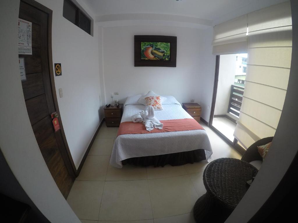 Postel nebo postele na pokoji v ubytování Hostal Costa del Pacifico