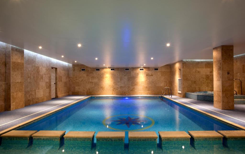 a swimming pool in a hotel with a ceiling at Esplanade Hotel in Newquay