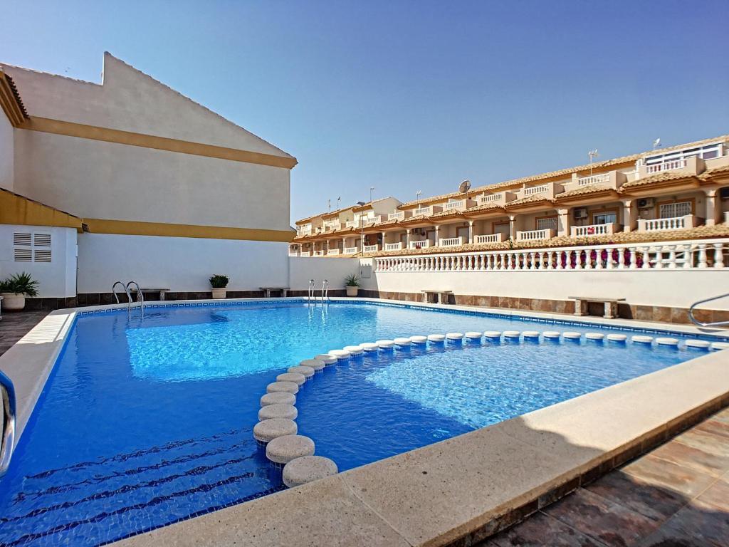 a large swimming pool in front of a building at San Pedro del Pinatar House - 5409 in San Pedro del Pinatar
