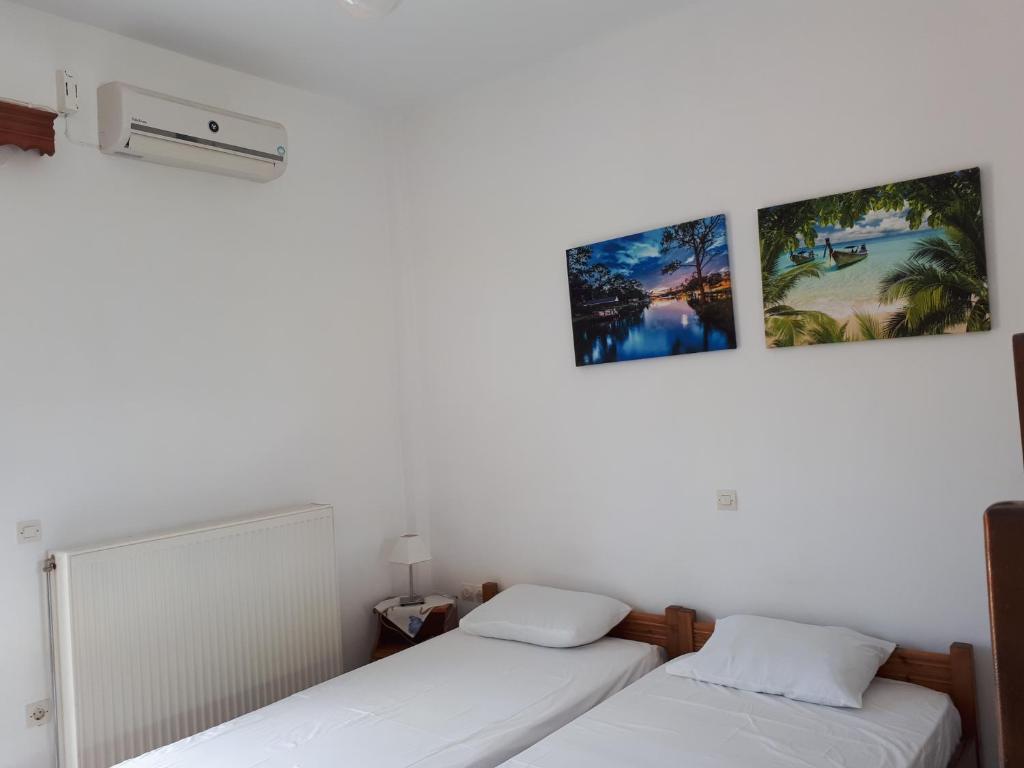 Postel nebo postele na pokoji v ubytování Pantelatos Studios