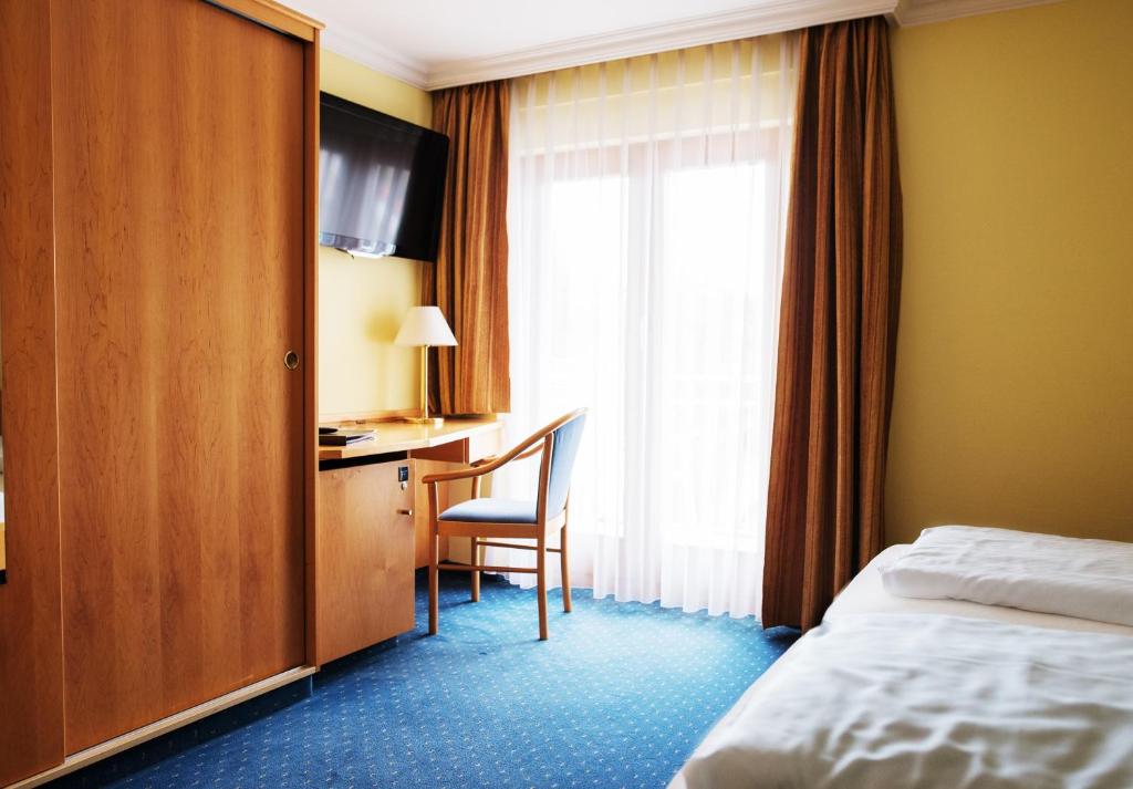 Postel nebo postele na pokoji v ubytování Sporthotel Schönblick