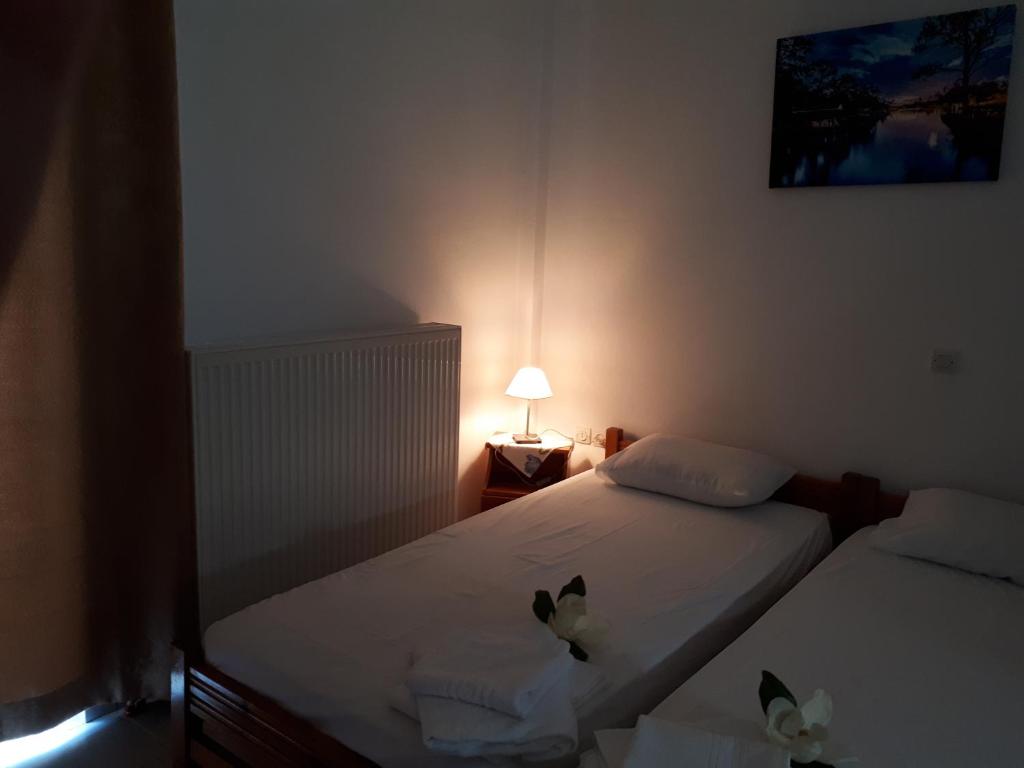 Postel nebo postele na pokoji v ubytování Pantelatos Studios