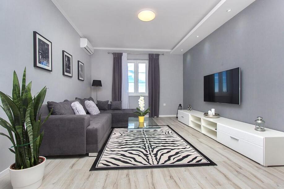 a living room with a zebra rug on the floor at Mandalina Suite in Šibenik