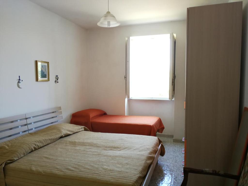 Postel nebo postele na pokoji v ubytování Villetta rustica di campagna
