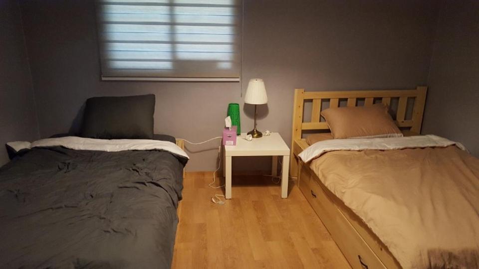 Postel nebo postele na pokoji v ubytování The Guesthouse DMZ Stay